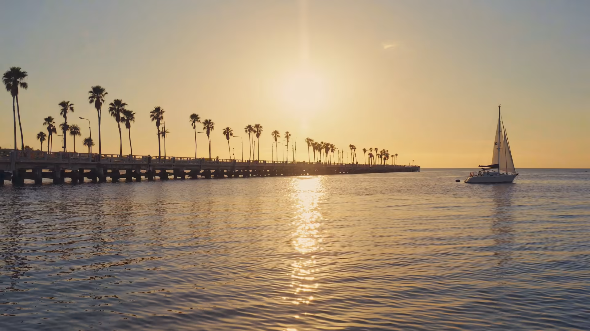 Venice, Florida coastal causeway at golden hour.